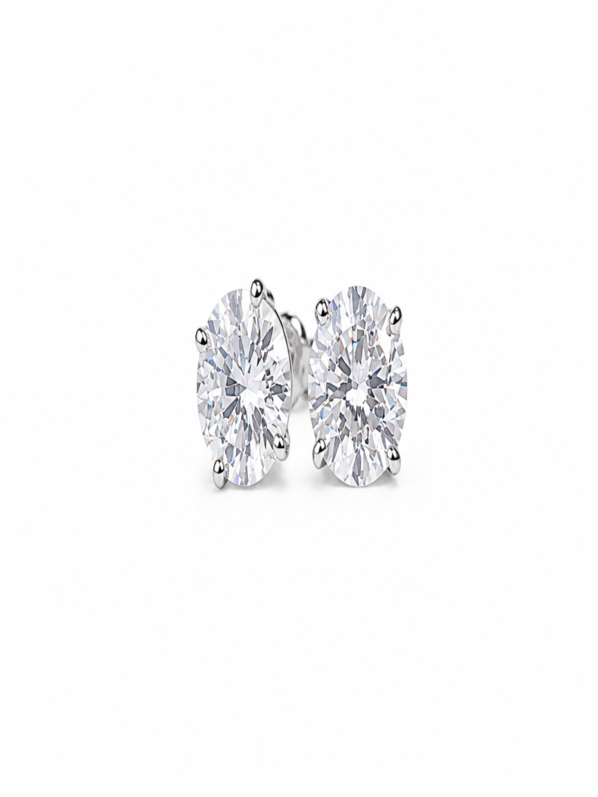 A pair of round-cut diamond stud earrings in a silver-toned setting, photographed on a clean white background.