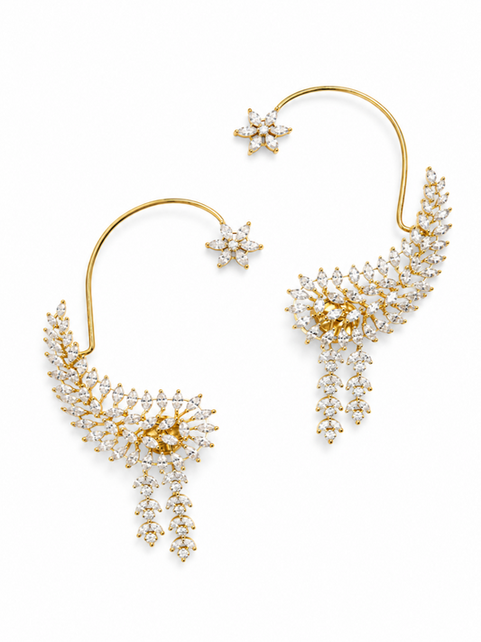 A pair of gold and diamond crescent moon drop earrings with matching star-shaped studs, displayed on a clean white background.