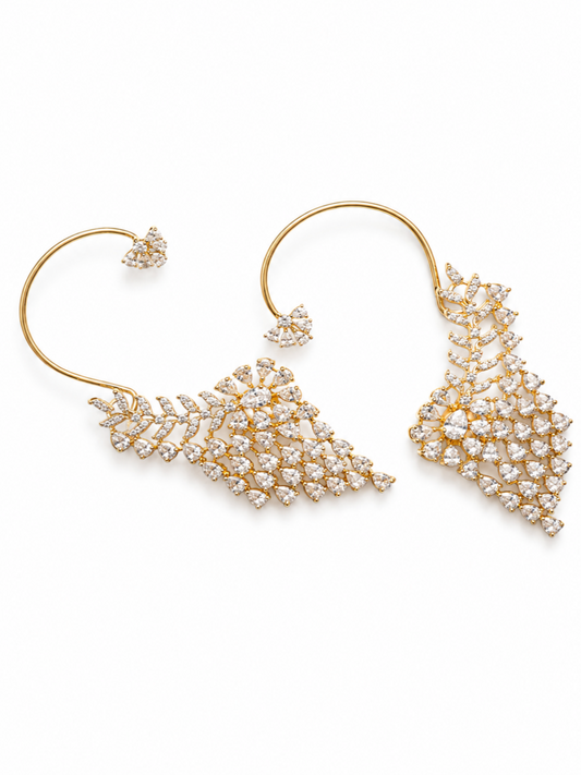 A pair of gold hoop earrings with intricate, tiered diamond clusters in a fan or leaf-like design, set against a plain white background.