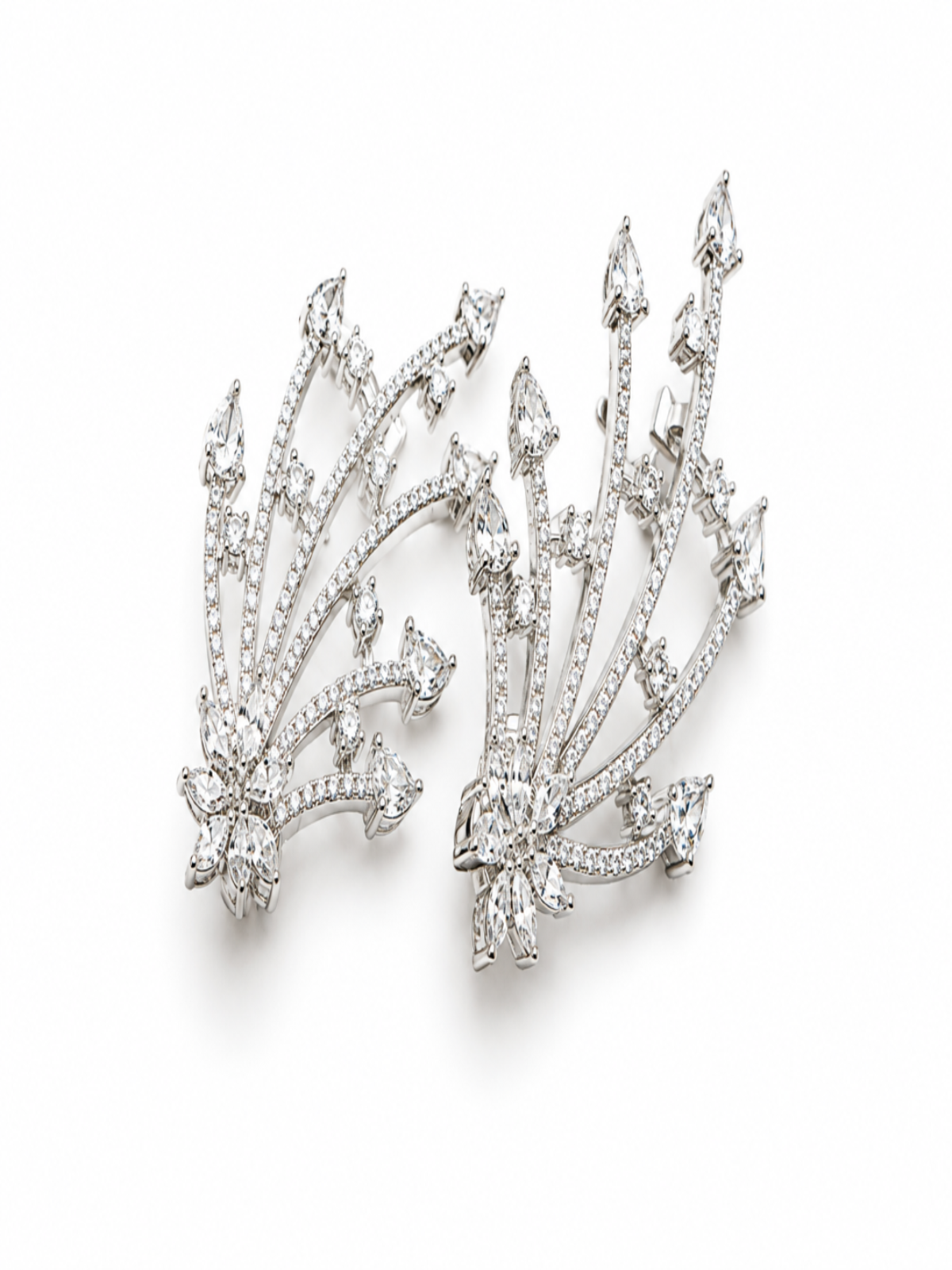 A pair of silver-toned diamond cluster earrings with a fanburst design, photographed on a clean white background.