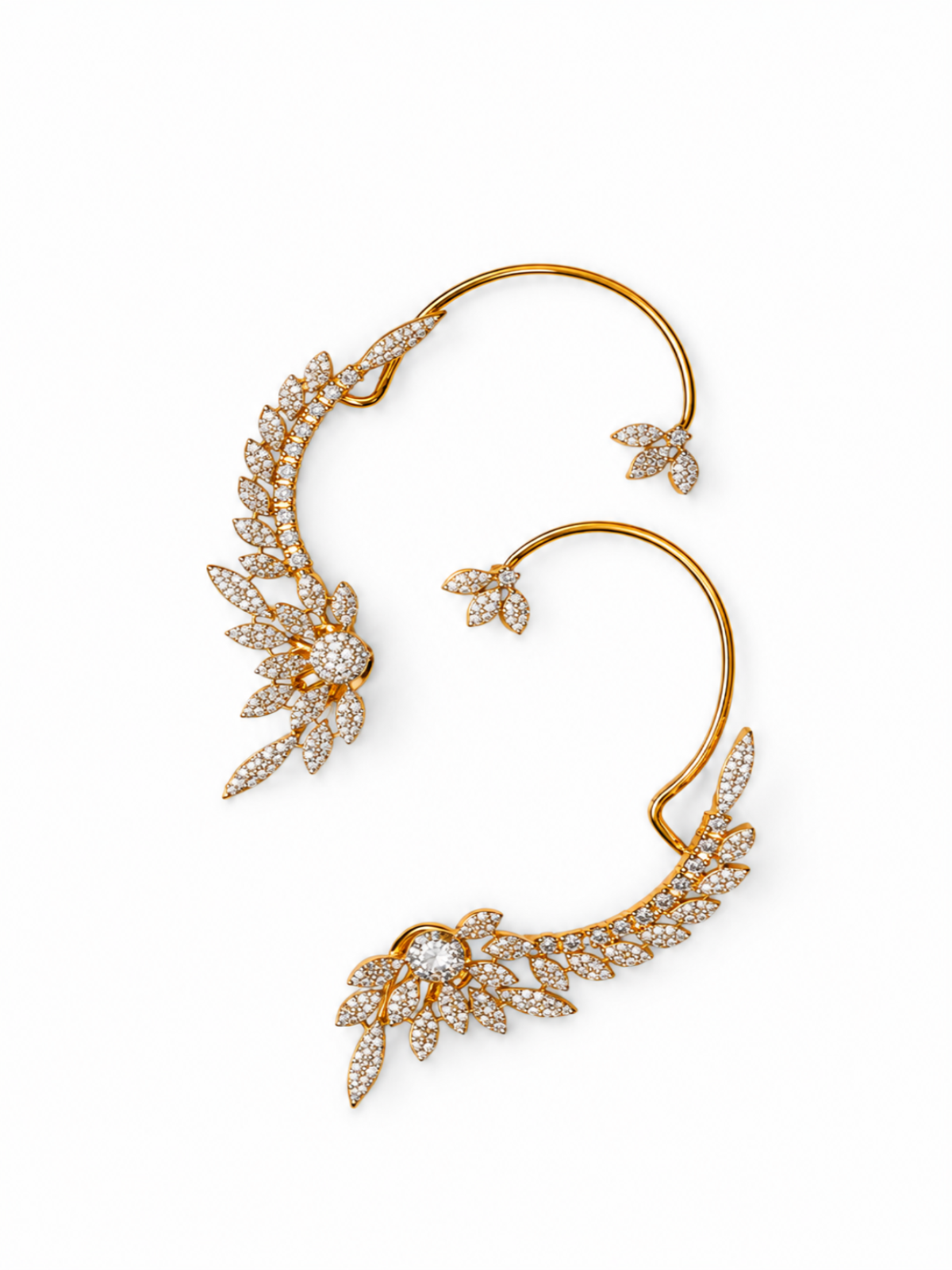 A gold ear cuff adorned with pavé-set diamonds in a leaf and vine motif, displayed on a clean white background.