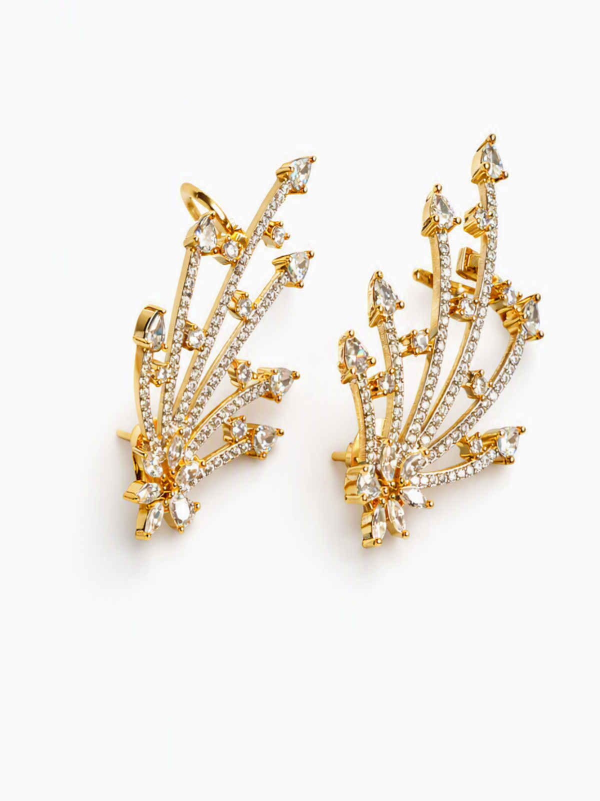 A pair of gold-toned statement earrings with clear marquise and round-cut stones arranged in a branching, leaf-like fan shape, photographed on a clean white background.