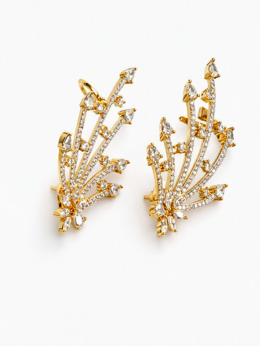 A pair of gold-toned statement earrings with clear marquise and round-cut stones arranged in a branching, leaf-like fan shape, photographed on a clean white background.